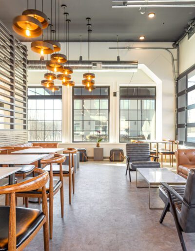Modern cafe interior with ample seating and natural light.